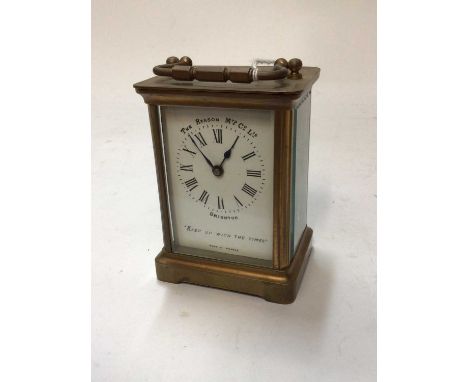 French brass carriage clock with white enamel dial marked "The Reason MFD Co. Ltd." "Keep up with the times", 11cm high, with