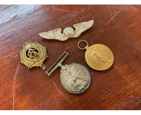 First World War Pair comprising War and Victory medals named to M2-22783 PTE. E. G. Proctor. A.S.C. Together with two badges.