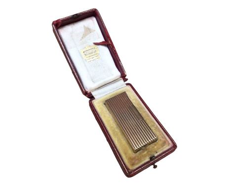 9ct gold lighter by A D Bach (Birmingham 1963), in a Cartier leather boxLighter is fully hallmarked and weighs 77.1 grams in 