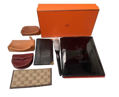 Designer accessories including Hermès shoe box, coin purses by Cartier, Longchamp and Osprey, small Gucci folder, Dunhill wal