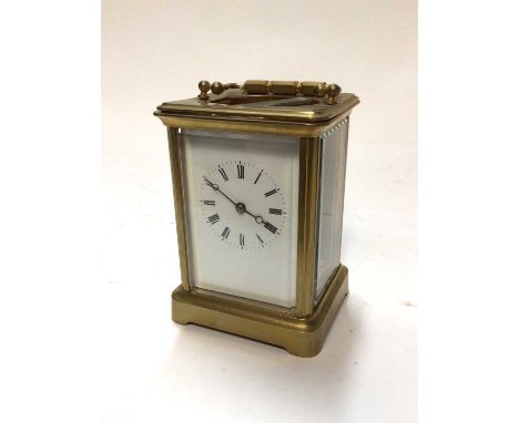 Brass cased carriage clock with enamel dial and key, 14cm high