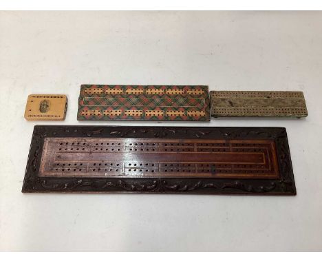 Four antique cribbage boards to include a Regency cribbage board, Mauchline ware cribbage board, Tartan ware and a carved and