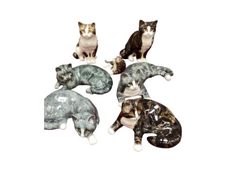 Seven Winstanley cats all signed by Mike HintonReclining tortoiseshell cat chipped to ear, one of the grey reclining cats has