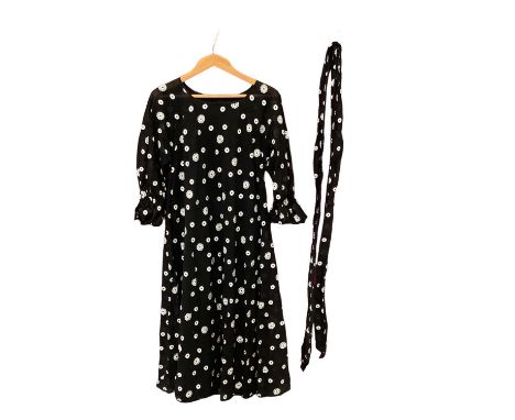 1970s sheer black maxi handkerchief dress. Plus a black chiffon dress with woven white flower heads, gathered half sleeves. B