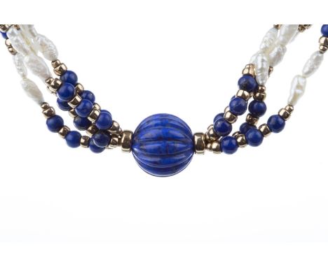 PEARL AND LAPIS LAZULI NECKLACE, comprising four strands of rice pearls, with lapis lazuli beads to the centre, with gold spa