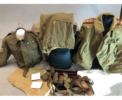 A TIN TRUNK CONTAINING A WORLD WAR II OXFORDSHIRE AND BUCKINGHAMSHIRE KHAKI GREAT COAT, PUTTEES, SWORD BELT, OXFORD HOME GUAR