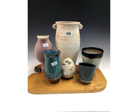 EDDIE CURTIS, A STUDIO POTTERY VASE, FOUR OTHERS, THE TALLEST.   H 29cms. TOGETHER WITH A STUDIO POTTERY SPECKLED EGG.