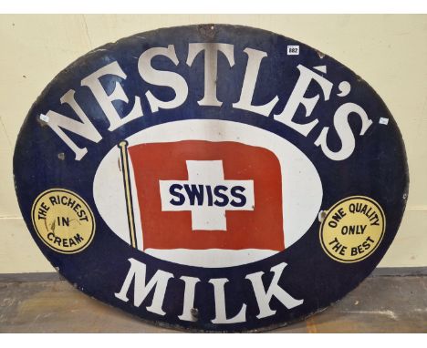 A NESTLES MILK OVAL ENAMEL SIGN, THE BLUE GROUND BORDER ENCLOSING THE SWISS FLAG CENTRALLY.   W 122cms