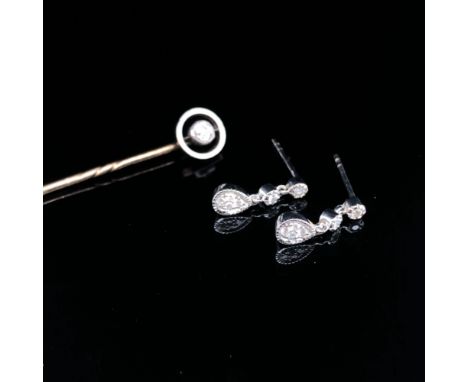 A PAIR OF DIAMOND SET DROP EARRINGS AND A DIAMOND SET STICK PIN. BOTH UNHALLMARKED, THE PIN HEAD ASSESSED AS 9ct THE PIN A LO