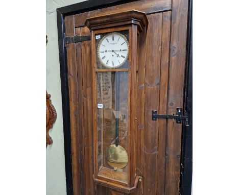 A WALNUT CASED VIENNA REGULATOR BY CONRAD BRODSKI, THE THREE TRAIN MOVEMENT STRIKING, CHIMING AND REPEATING ON COILED RODS BE