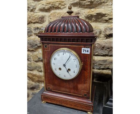 A 19th C. MAHOGANY MANTLE CLOCK, THE FRENCH MOVEMENT STRIKING ON A COILED ROD, THE CIRCULAR ENAMEL DIAL WITH ARABIC NUMERALS 