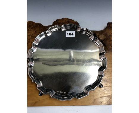 A SILVER WAITER BY ERNEST HAYWOOD, BIRMINGHAM 1936, THE PIE CRUST RIM ABOVE FOUR HOOF FEET, 513grms. Dia. 25cms