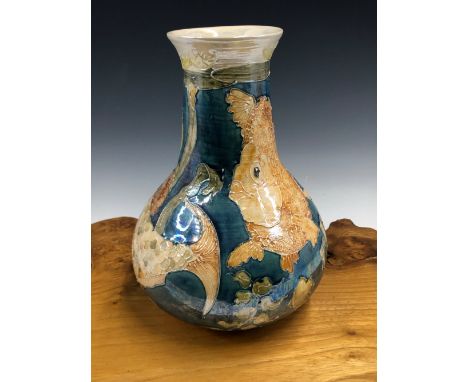 A LISE B MOORCROFT 1992 FISH PATTERN BOTTLE VASE, THE GOLD FISH ON A BLUE GROUND.   H 25.5cms.