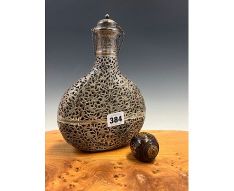 AN INDIAN WHITE METAL OVERLAY FLASK AND STOPPER PIERCED AND ENGRAVED WITH BIRDS AND FOLIAGE..   H 23cms. TOGETHER WITH A TREE