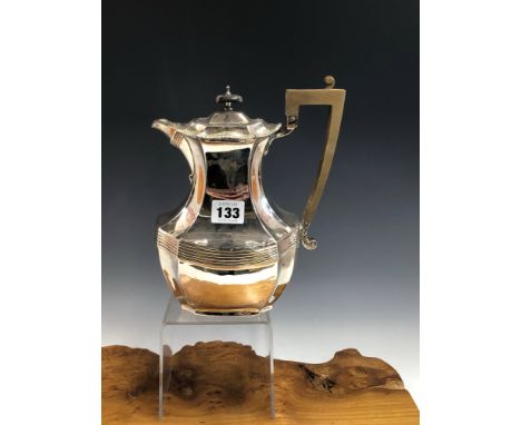 A SILVER COFFEE POT BY JAMES DIXON AND SONS, SHEFFIELD 1904, THE LOWER TERMINAL OF THE HANDLE JOINING A REEDED BAND ABOUT THE