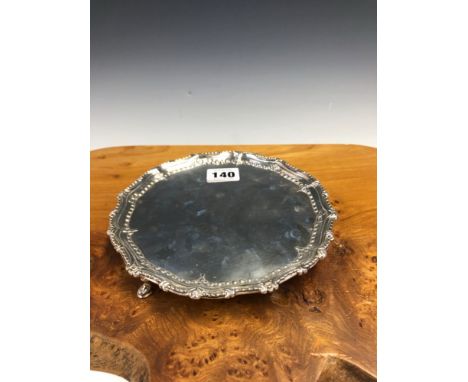 A SILVER WAITER BY WILLIAM TUITE, LONDON 1775, THE RIM WITH TWO BEAD AND SCROLL BANDS ABOVE THE THREE HOOF FEET, 262grms.   D
