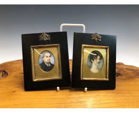 TWO 19th C. PORTRAIT MINIATURES IN MODERN FRAMES, ONE PAINTED WITH A MAN OF THE CLOTH AND THE OTHER A YOUNG LADY, THE OVAL PO