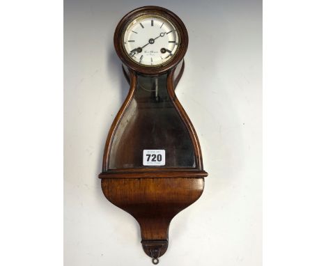 A GLAZED ROSEWOOD WALL CLOCK THE ENAMEL DIAL INSCRIBED HENRI MARC, THE MOVEMENT STRIKING ON A BELL THE PENDULUM VISIBLE THROU