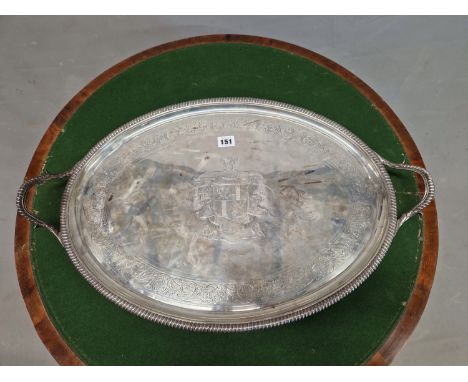 A SILVER TWO HANDLED OVAL TRAY BY HANNAM AND CROUCH, LONDON 1803, THE CENTRE ENGRAVED WITH AN ARMORIAL AND THE MOTTO MALO MOR