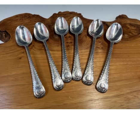 A SET OF SIX SILVER FEATHER EDGED DESSERT SPOONS, LONDON 1750, THE SHELL TOPPED HANDLES WITH A CREST IN AN ESCUTCHEON, 219grm
