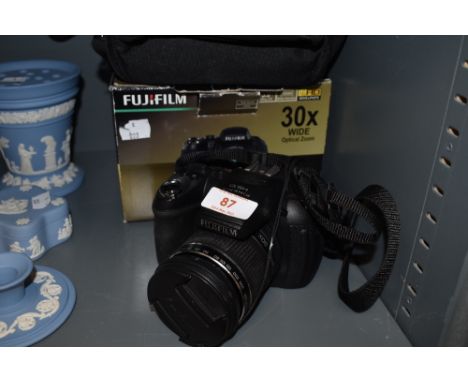 A Fujifilm Finepix HS10 camera.