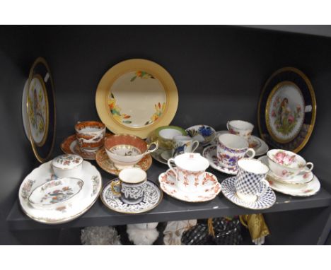 A mixed lot of vintage ceramics including highly decorated cups and saucers, plates and more.
