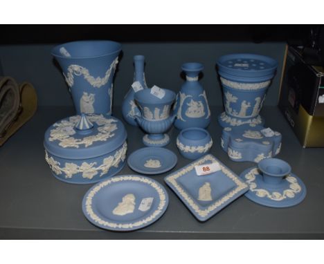 A mixed collection of Wedgwood including vases, trinket dishes and more.