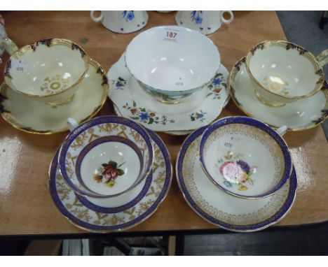 A selection of fine tea cups and saucers including Shelley hand decorated and Davenport