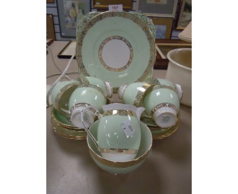 A part tea service by Grafton having gilt and green decoration