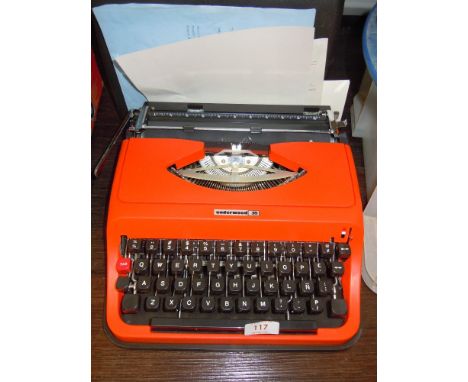 A genuine vintage Underwood typewriter in a bright 70's orange body as new