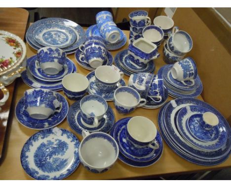 A selection of vintage blue and white wear ceramics including tea cups and saucers Willow wear etc