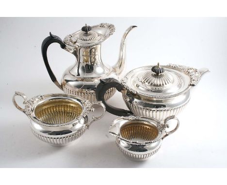 A LATE VICTORIAN / EDWARDIAN FOUR-PIECE TEA & COFFEE SERVICE  with part-fluted circular bodies and decorative borders of gadr