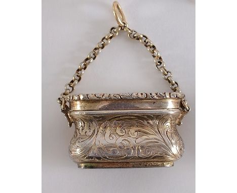 A VICTORIAN SILVERGILT VINAIGRETTE in the form of an engraved bag or purse with a suspensory chain, the cover with engine-tur