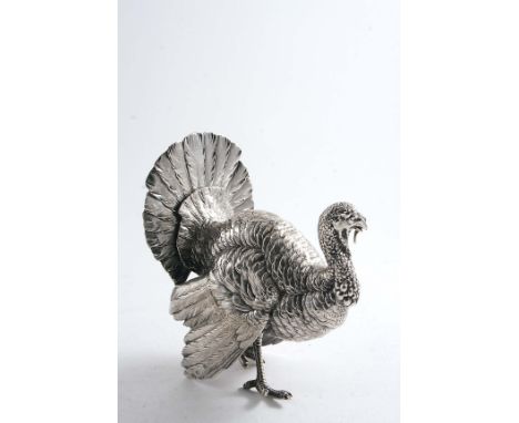 A LATE 19TH/ EARLY 20TH CENTURY GERMAN NOVELTY TABLE DECORATION in the form of a turkey cock with a slot to put a menu card i