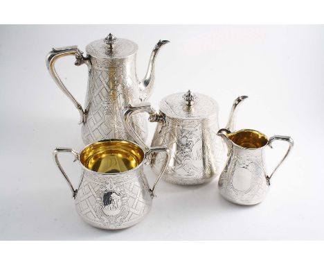 A VICTORIAN FOUR-PIECE TEA & COFFEE SERVICE with tapering circular bodies, engraved all over with trellis-work and two cartou