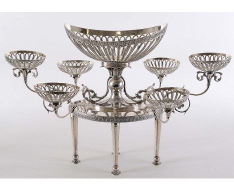 A GEORGE III EPERGNE on four tapering fluted legs with chased pad feet, the oval frame with a rising centre and ball knop sup