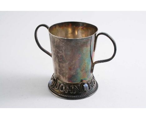 A SMALL POST WAR TWO-HANDLED CUP with the applied name "John Howard Spring" around the foot, interspersed with moonstone boss