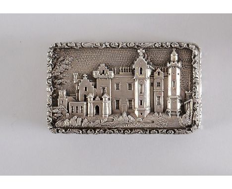 AN EARLY VICTORIAN "CASTLE TOP" VINAIGRETTE rectangular with raised borders & engine-turning, the cover with a view of Abbots