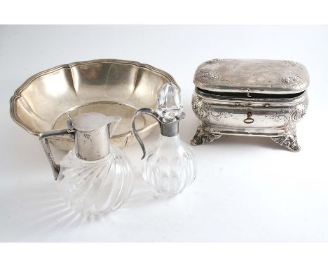 A 19TH CENTURY GERMAN EMBOSSED CADDY of rounded oblong form with lock & key & gilt interior, a 20th century German dish with 