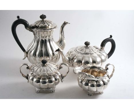 A MODERN FOUR-PIECE TEA & COFFEE SERVICE of melon-fluted form with shell & scroll feet, all initialled "M", (the sugar bowl w