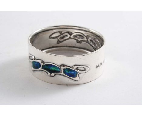 AN EDWARDIAN ART NOUVEAU NAPKIN RING decorated on each side with green/blue enamel by W.H. Haseler, Birmingham 1905;  2"  (5 