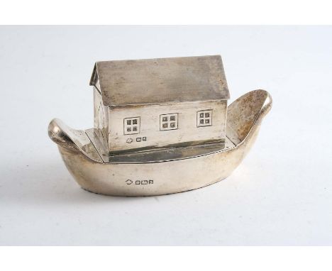 AN EARLY 20TH CENTURY NOVELTY DUAL COMPARTMENT BOX resembling a stylised Noah's Ark, the roof hinging to reveal one compartme