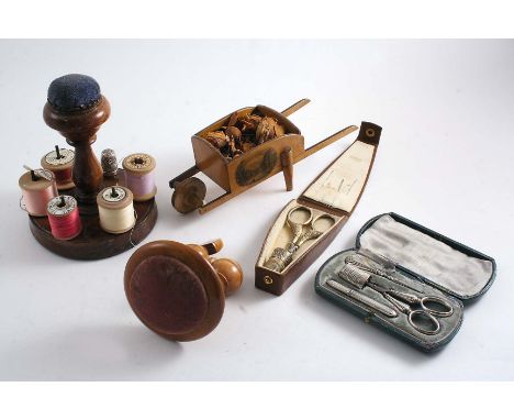 SEWING:- A turned wooden cotton reel stand with a pin cushion handle, a pair of French silvergilt mounted steel scissors and 