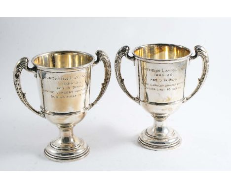 A SMALL TROPHY CUP with harp-shaped handles inscribed "Northern Laying Test 1934-35 for five birds laying largest number of e