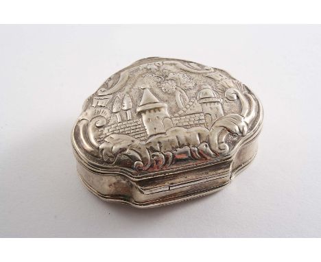 A LATE 19TH CENTURY TURKISH SNUFF BOX of cartouche form chased on the cover with an architectural scene and struck twice with