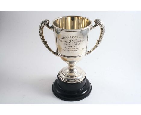 A TROPHY CUP with harp-shaped handles, inscribed "National Laying Test 1928-29....Breeders cup...4 Black Leghorns 874 eggs", 