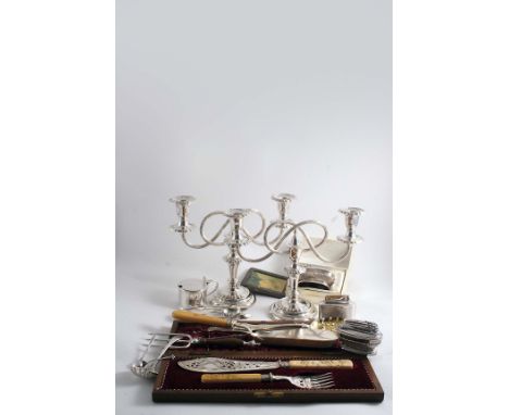 PLATED WARE:- A cased pair of late Victorian fish servers with carved ivory handles in the Japanese taste, a pair of twin-lig