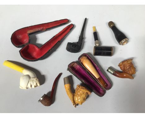 A metamorphic pipe with outer case modelled as a bottle marked 'Scottish National Exhibition Edinburgh 1908', together with a