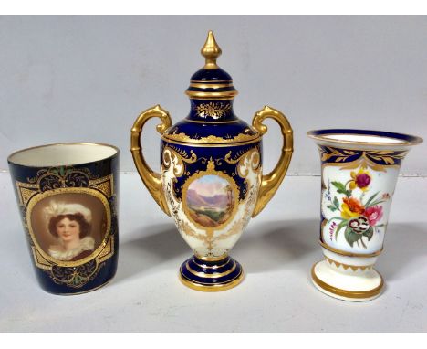 A Royal Vienna porcelain beaker painted with a portrait of a young lady, to a blue ground with gilding and jeweling, 9cm high