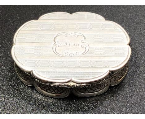 A Victorian silver oval shaped vinaigrette with engine turned decoration and central cartouche engraved 'Annie', hinged cover